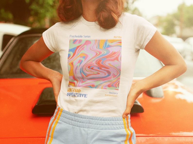May include: White t-shirt with a colorful abstract design and the text "Psychedelic Series", "Retrospective", "Gallery Exhibition", and "4070s".