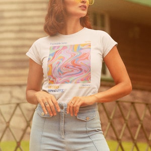 May include: White t-shirt with a colorful abstract design and the text "Psychedelic Series" and "Retro Perspective".