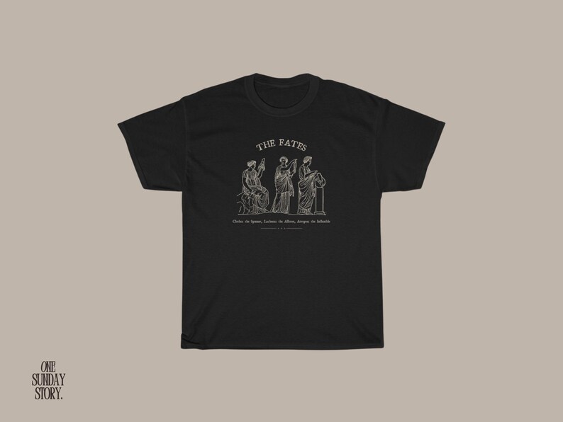 May include: Black t-shirt with a white graphic of three figures representing the Fates, with the text "THE FATES" above them. The text below the figures reads "Clotho the spinner, Lachesis the allotter, Atropos the inevitable."