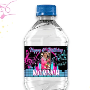 May include: A clear plastic water bottle with a blue cap. The label features a photo, musical notes, and the text "Happy 6th Birthday MARIYAH". Pink and blue musical notes and stars decorate the background.