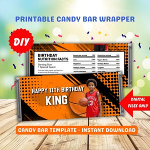 May include: Printable candy bar wrapper template with a basketball theme. The wrapper is orange and black with a photo of a boy holding a basketball. The text "Happy 11th Birthday King" is printed on the wrapper.