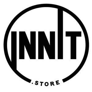 May include: A black and white circular logo featuring the word INNIT in bold, uppercase sans-serif letters. The letter I on the left and the letter T on the right extend vertically to touch the circular border. The text .STORE appears below.