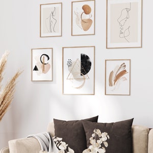 May include: A set of six minimalist art prints in wooden frames, featuring abstract shapes, line drawings, and geometric patterns in shades of brown, black, and white.
