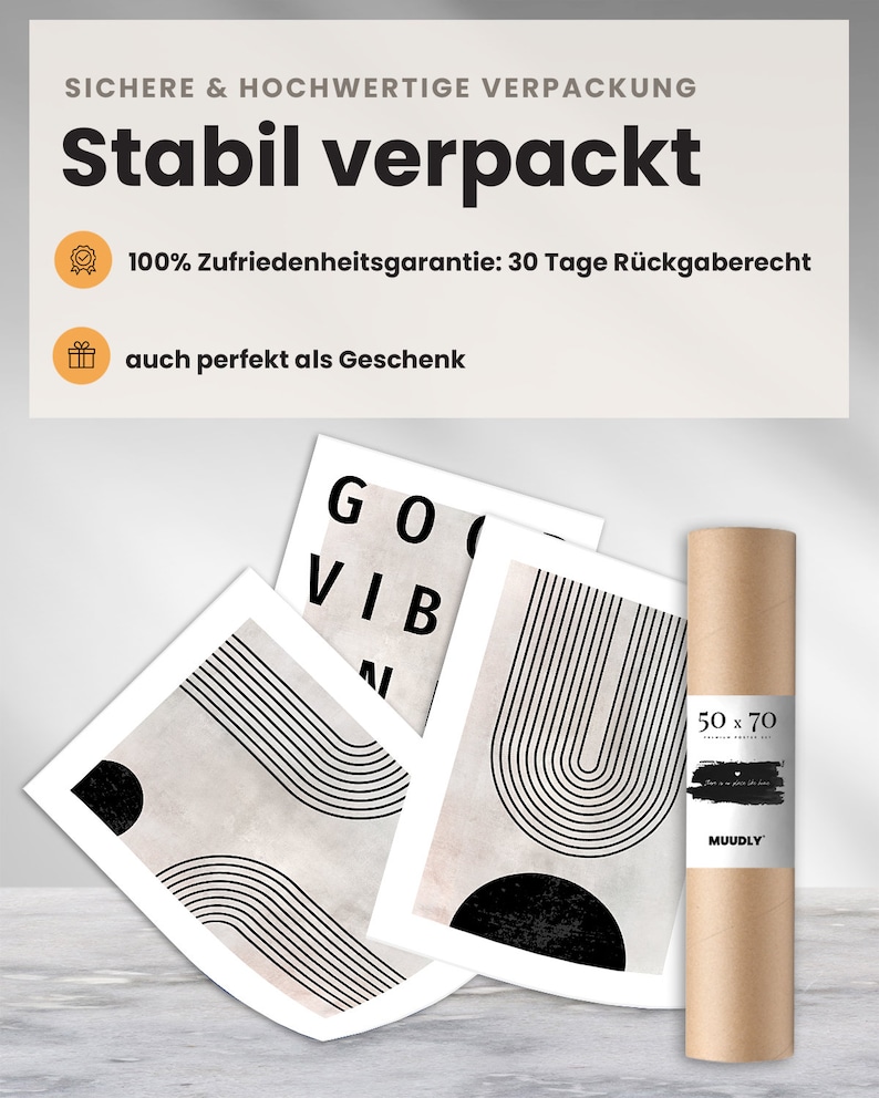 May include: A collection of art prints with abstract black and white designs, including the words "GOOD VIBES". The prints are displayed with a rolled-up poster in a brown tube, labeled "50 x 70". The packaging is labeled "Stabil verpackt".