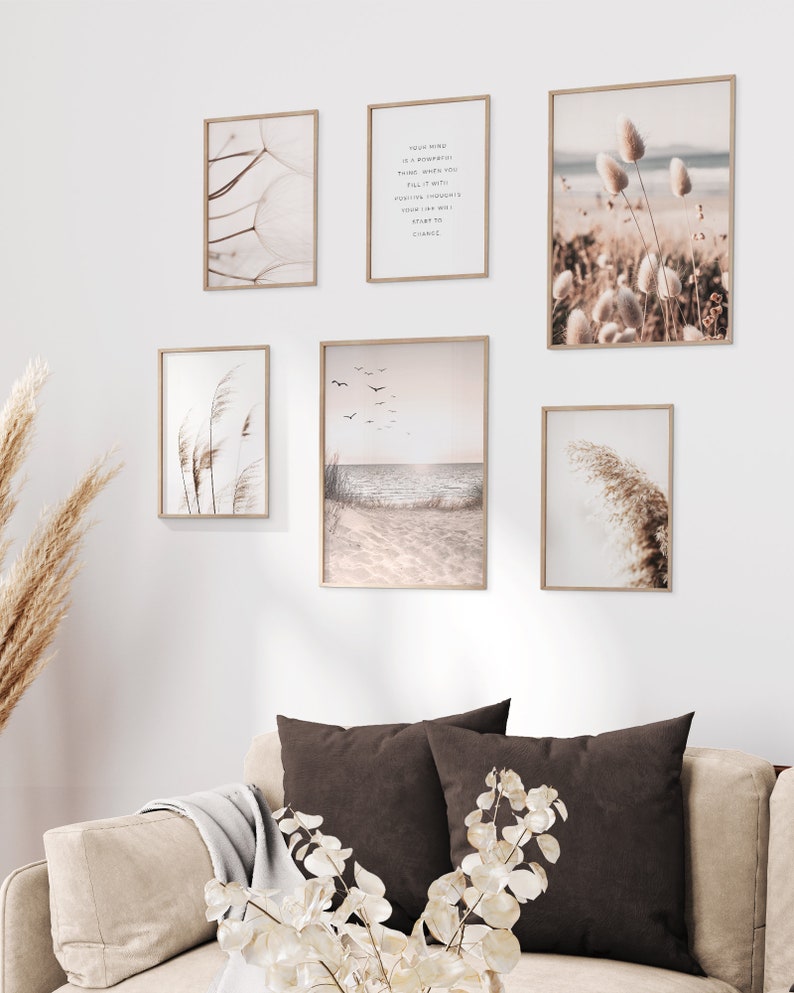 May include: A set of six framed prints with a beach theme. The prints feature images of seashells, grasses, and a beach scene with birds flying over the ocean. The prints are all in a neutral color palette of beige, brown, and white.