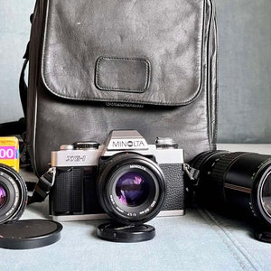 Minolta XG-1 35mm film SLR camera, Minolta MD 50mm 1:1.7 lens + two lenses included