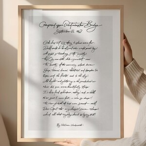 May include: A framed print of William Wordsworth's poem "Composed upon Westminster Bridge." The handwritten text is in black ink on a white background, set within a light wood frame. The poem's title and date are at the top.