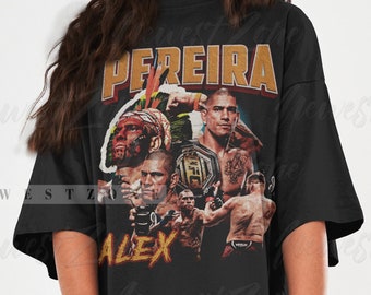 May include: Black oversized t-shirt with a graphic print of a mixed martial arts fighter with the text "PEREIRA" and "ALEX" on the front.