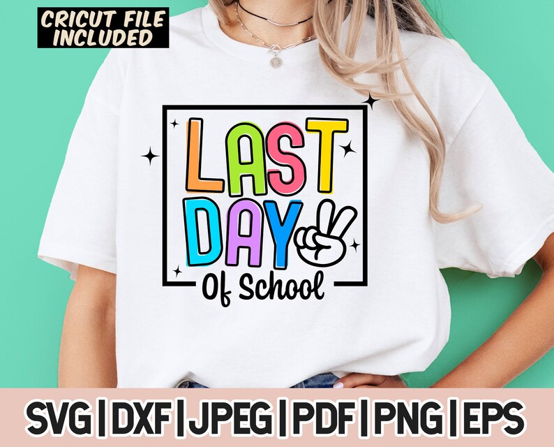 May include: A white t-shirt with a colorful graphic that says "Last Day of School" with a peace sign. The graphic is in a black rectangle with a white outline.