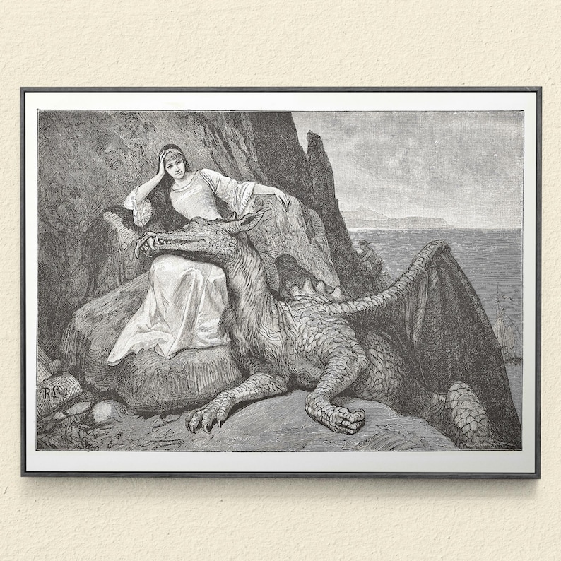 May include: Black and white framed print of a woman and a dragon. The woman is seated on a rock, wearing a long dress and resting her head on her hand. A dragon is lying down next to her, with its head near the woman.