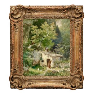 May include: A framed oil painting depicting a small cottage nestled in a lush green forest. The cottage has a white exterior and a brown roof. A figure in a brown dress stands near the cottage door. The painting is set against a backdrop of rocky cliffs and dense foliage.