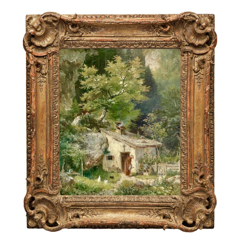 May include: A framed oil painting depicting a small cottage nestled in a lush green forest. The cottage has a white exterior and a brown roof. A figure in a brown dress stands near the cottage door. The painting is set against a backdrop of rocky cliffs and dense foliage.