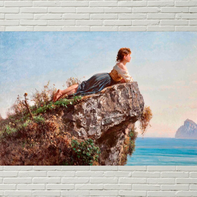 May include: A woman in a blue and white dress sits on a rocky cliff overlooking a body of water. The woman is looking out at the water, and the sky is a light blue.