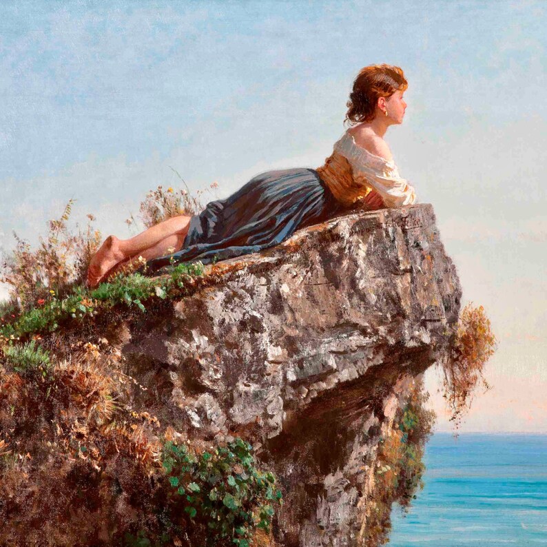 May include: A woman in a blue and brown dress lies on a rocky cliff overlooking a blue sea. The sky is a light blue with white clouds.