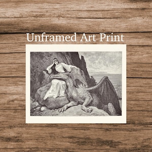 May include: An unframed art print featuring a black and white engraving of a person in a long gown sitting on a rock next to a large, scaled dragon with wings. The text "Unframed Art Print" is printed in white above the rectangular illustration.