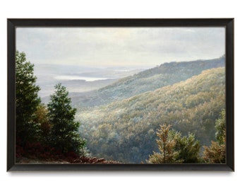 May include: A framed landscape painting depicts a mountain range covered in trees, with a lake in the distance. The artwork features a muted color palette of greens, browns, and blues, with a black frame.