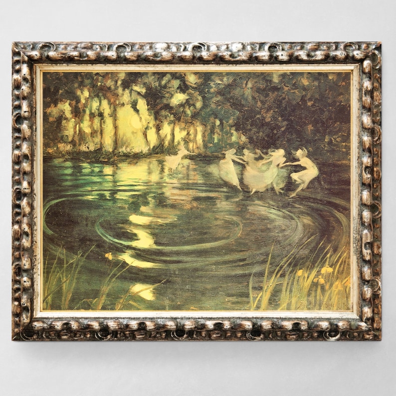 May include: A framed painting depicting a group of fairies dancing in a circle in a forest clearing. The fairies are wearing white dresses and have long flowing hair. The water in the clearing is a deep green color and reflects the light of the sun. The forest is lush and green, with tall trees and ferns.