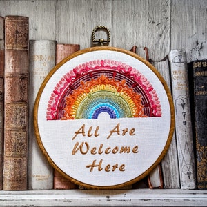 All are welcome here. Machine embroidered 8&quot; hoop. Vintage embroidery art with modern inspiration. LGBTQIA pride wall art. One love. Rainbow