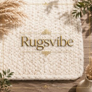 May include: A cream-colored, chunky knit rug with a thick, braided border. The word Rugsvibe is centered in gold serif lettering, framed by decorative gold flourishes above and below the text, set against a soft, textured fabric surface.