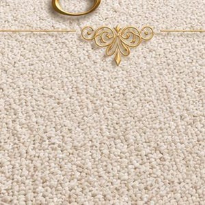 May include: A rectangular area rug with a textured, off-white surface. The rug features a gold-colored circular ring centered at the top edge, accompanied by a decorative gold-colored filigree emblem positioned directly below the ring.