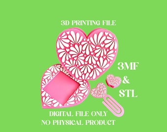 May include: Pink heart-shaped 3D printing files with white floral patterns. The image includes a heart-shaped box, a bookmark, and a small heart. Text on the image reads "3D PRINTING FILE", "3MF & STL", and "DIGITAL FILE ONLY NO PHYSICAL PRODUCT".