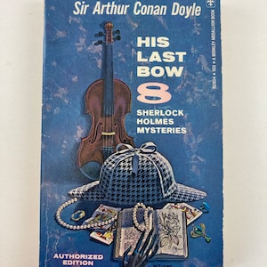 May include: A blue book cover with the title "His Last Bow" and the author "Sir Arthur Conan Doyle". The cover features a violin, a deerstalker hat, a book, and a string of pearls. The book is part of the "Sherlock Holmes Mysteries" series.
