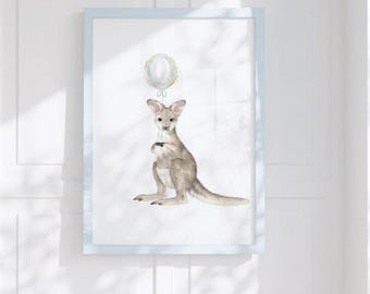 May include: A framed wall art print featuring a watercolor illustration of a light brown kangaroo holding a single white balloon with gold glitter accents. The artwork is encased in a light blue frame and includes the text Sweet Street Art.