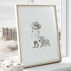 Watercolor print of a baby koala walking with a toddler girl in a white dress, bare feet, and a straw hat. Painted in delicate grey and white tones, it is on a white background. Perfect for an Australian animal-themed baby room or any space