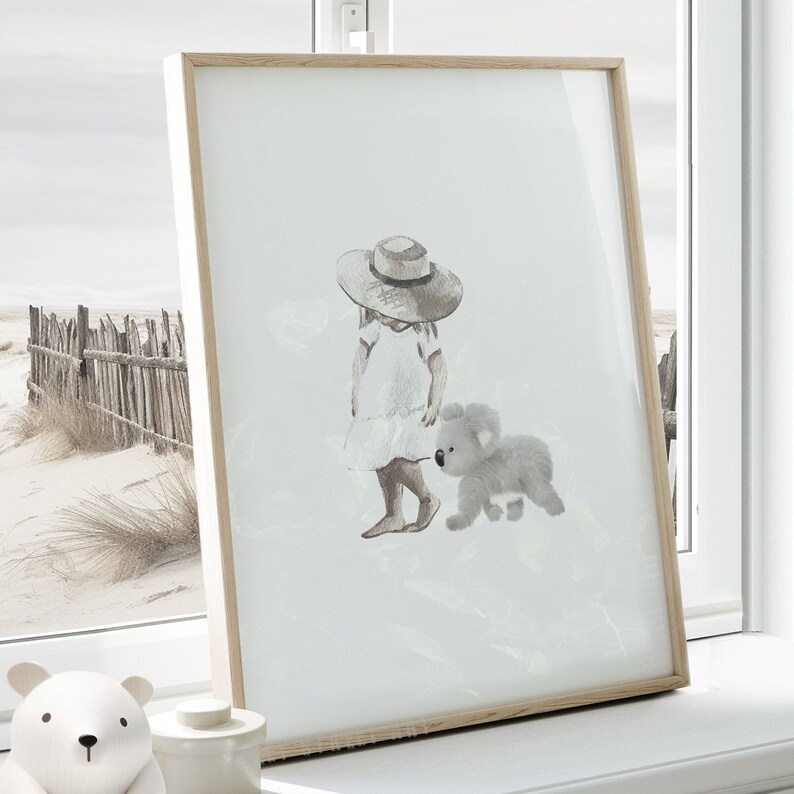 Watercolor print of a baby koala walking with a toddler girl in a white dress, bare feet, and a straw hat. Painted in delicate grey and white tones, it is on a white background. Perfect for an Australian animal-themed baby room or any space
