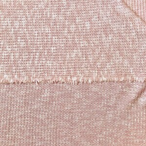 May include: A close-up of a pink waffle knit fabric with a textured surface.
