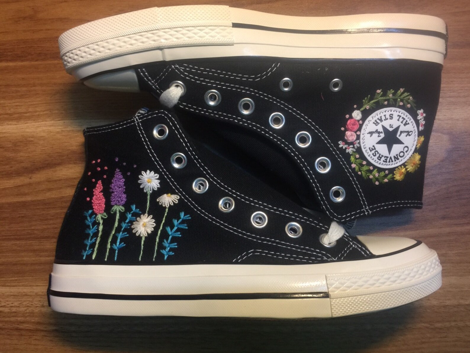 beige converse with flowers