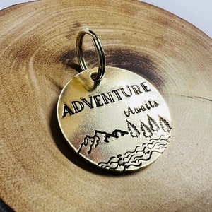 Personalised hand stamped brass dog ID tag with adventure awaits design, dog tag, cute dog tag, no name dog tag