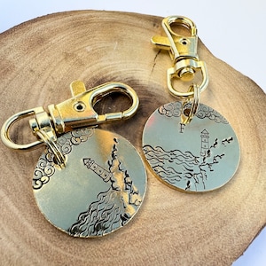 Personalised hand stamped brass dog collar ID tag disc with seaside theme, perfect gift for dog owner, or a beach walk loving dog owner