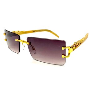 Occhiali da sole vintage con montatura in legno e pantera dorata Jaguar