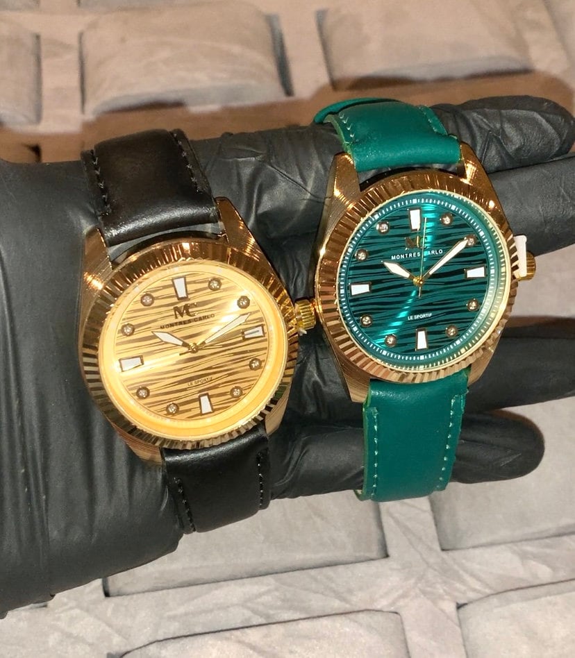 Gold watch shop green face
