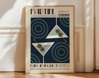 May include: A vintage-style poster with a blue background and a stylized illustration of two martini glasses with olives. The text "MARTINI" is in a bold, black font and the text "Delicious! 1996" is in a smaller, white font. The poster also includes the text "MADE IN AMERICA 1435 HUPERT AV NEW YORK CITY".
