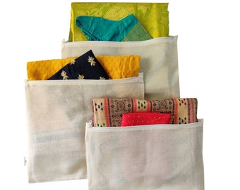 May include: Four white cotton zippered pouches with different colored fabrics inside. The pouches are made of natural cotton and have a zipper closure. The fabrics inside the pouches are yellow, green, red, and black.