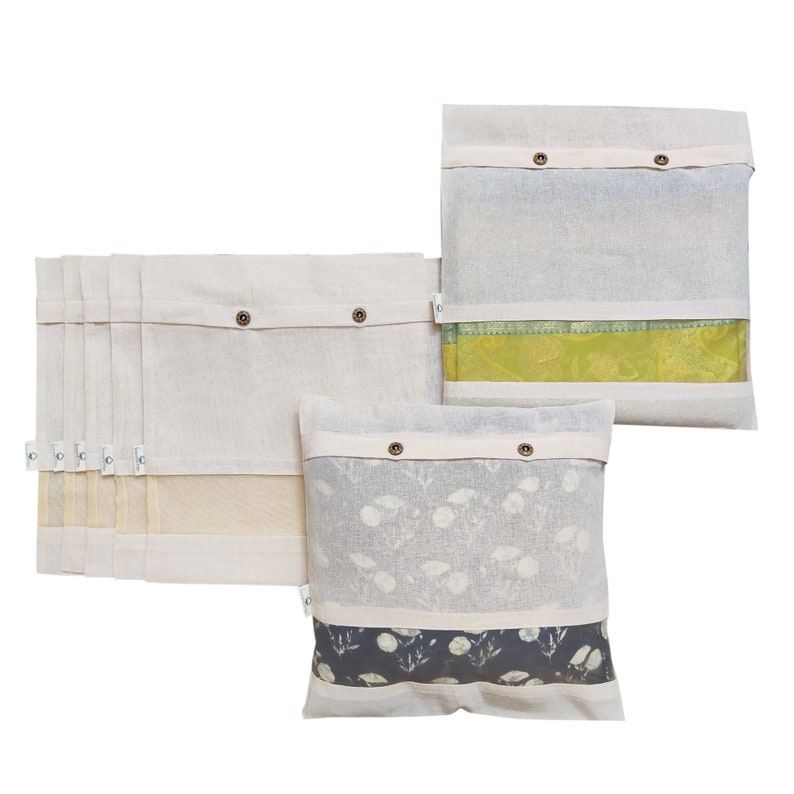May include: Set of three white cotton storage bags with a clear window. The bags have a button closure and are perfect for storing and organizing items. The bags are shown with different patterned fabrics inside.