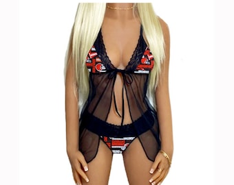 May include: Black sheer lingerie set with a lace trim. The top has a tie closure and the bottom has a Cleveland Browns print.
