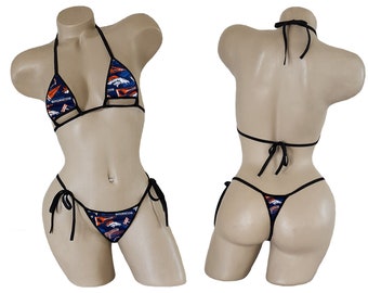 May include: A black bikini with a blue and orange print featuring the Denver Broncos logo. The bikini top has a halter style and the bottom is a string bikini.