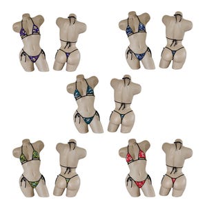 May include: Eight mannequins wearing different patterned bikini sets. The bikinis are in various colors, including green, red, blue, and purple. The bikinis have a triangle top and a string bottom.