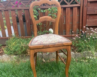 Romantic antique chair, next to the bed or dressing table.