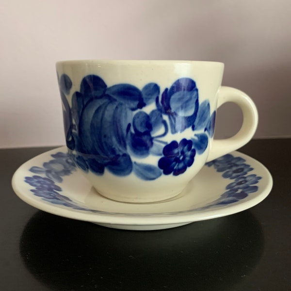 Polish earthenware cup, decorated by hand in Włocławek in Poland. Traditional Polish blue flower pattern.