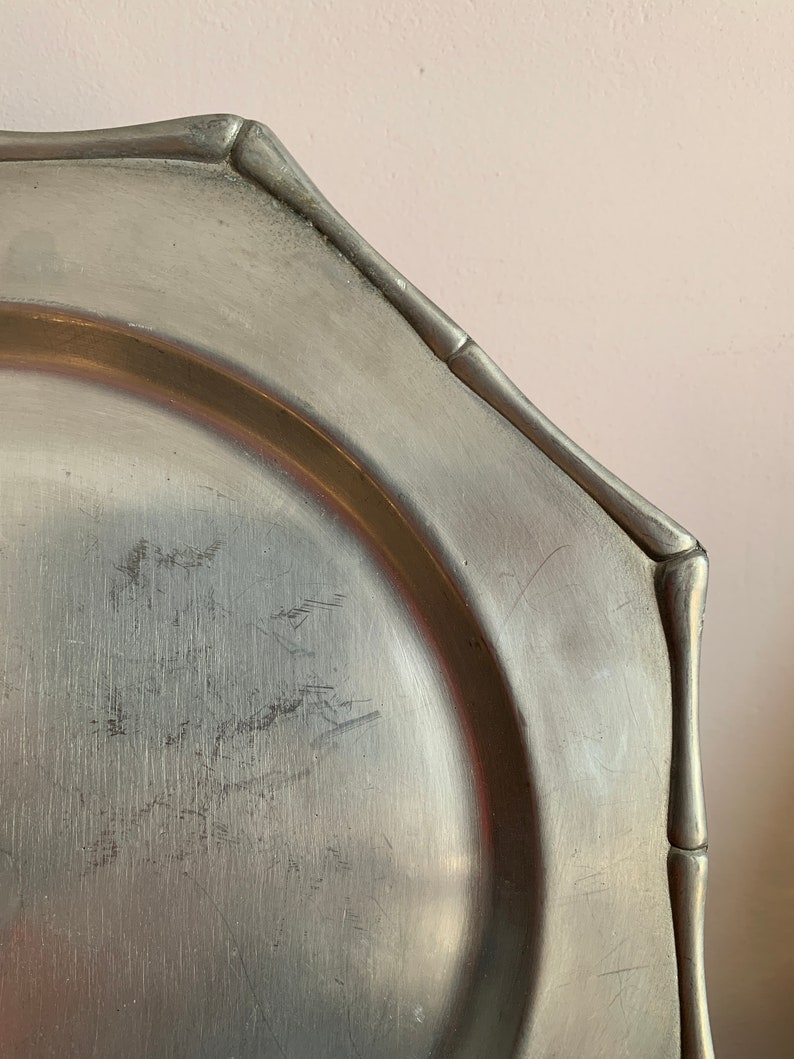 A Set of 8 Octagonal Dishes, Elegant Trivet in Stylish White Iron, the