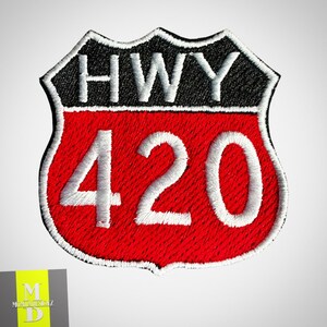 May include: Red and black highway sign patch with white text that reads "HWY 420".
