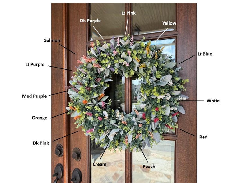 May include: A circular wreath featuring green foliage and various colored floral accents labeled as Dk Purple, Lt Pink, Yellow, Salmon, Lt Purple, Med Purple, Orange, Dk Pink, Cream, Peach, Lt Blue, White, and Red, displayed on a brown wooden door.