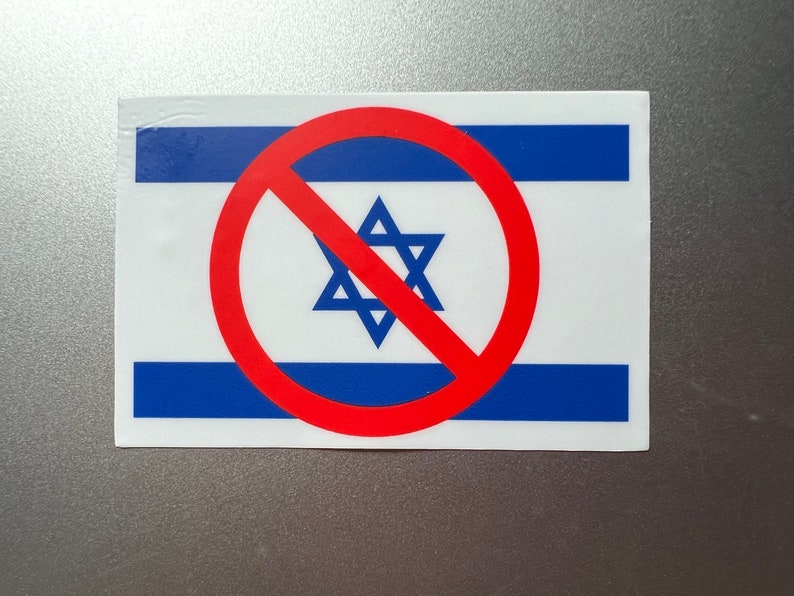 May include: A sticker featuring the flag of Israel with a red circle and slash symbol superimposed over it. The flag has blue stripes on a white background, with a blue Star of David in the center.
