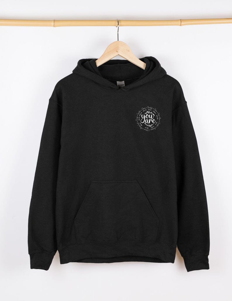 May include: Black hooded sweatshirt with a white graphic print that says "Be you are" in a circle.