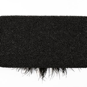 May include: A black beaded clutch with a feather trim. The clutch is made of small, tightly woven beads and has a fringe of black feathers around the bottom.