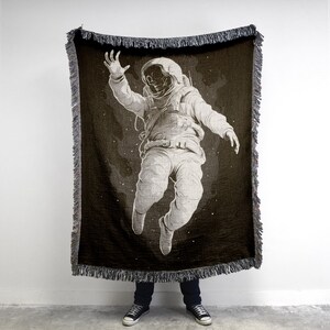 Skeleton Astronaut Woven Blanket: Vintage Sci-Fi Horror Tapestry